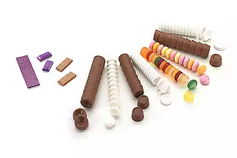 Chewing gum and confectionery packaging solutions Various individual confectionery lie unpacked next to each other