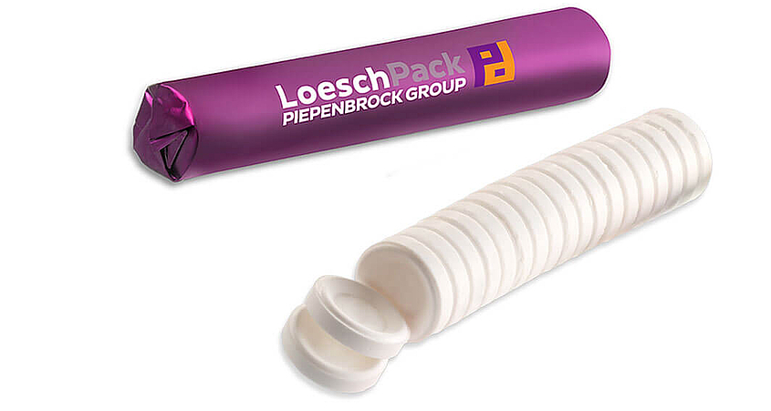 Verpackung für gepresste Tabletten Eine Rolle weiße gepresste Tabletten ohne Verpackung und eine Rolle mit lilafarbener Verpackung und LoeschPack Logo