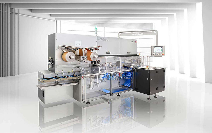 Modern Packaging Machine of LoeschPack side view of a modern packaging machine