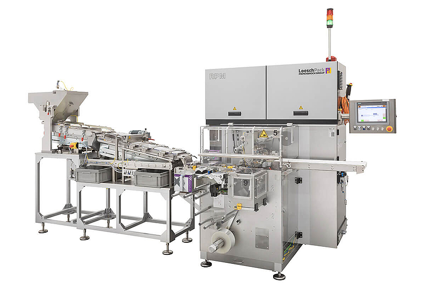 side general view fold wrapping machine with wrapping head from Loeschpack 