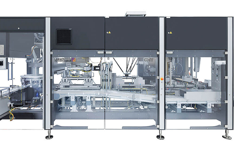 Toploading cartoning machine CMT from LoeschPack Side view cartoning machine CMT looking at the conveyor belt.